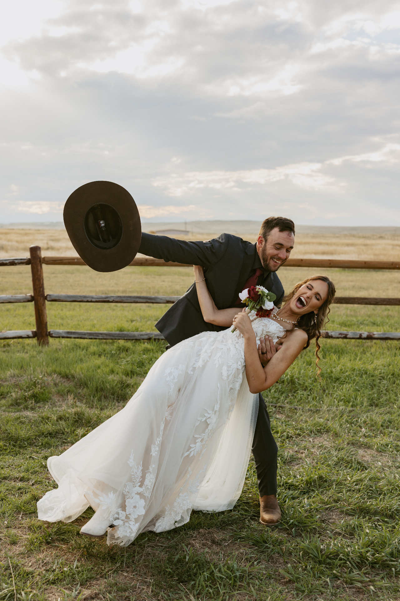 Alexa and her husband laughing on their wedding day